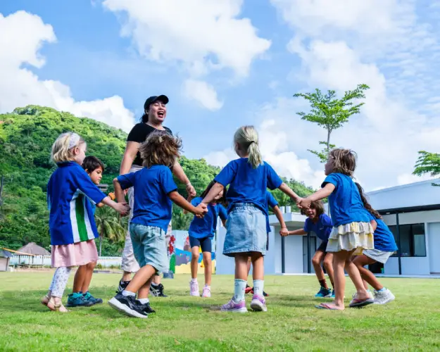 Children enjoying outdoor playtime, fostering friendship and teamwork.