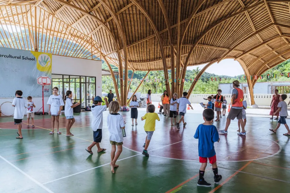 Children engaging in playful activities in Manta Hall at Mandalika International School.