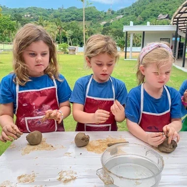 Mandalika students engaging in hands-on activities with clay.