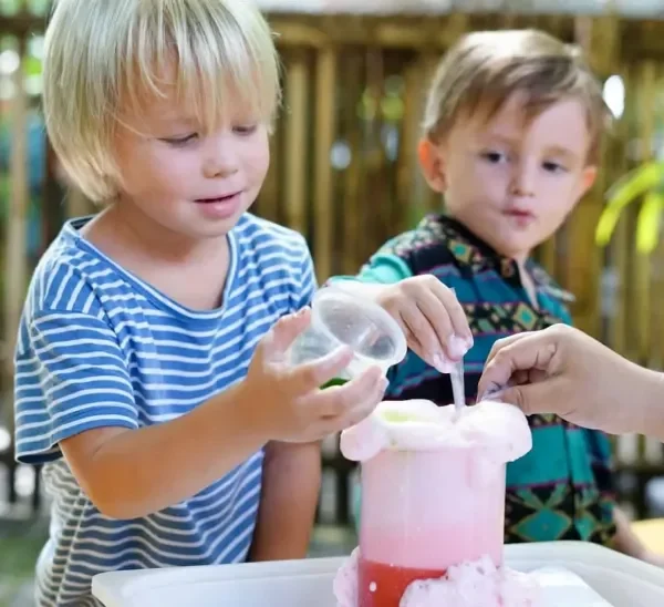 A toddler engaging in a fun science experiment.